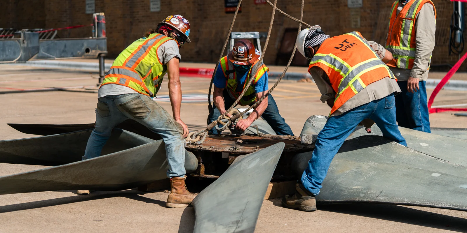 Men working on heavy equipment